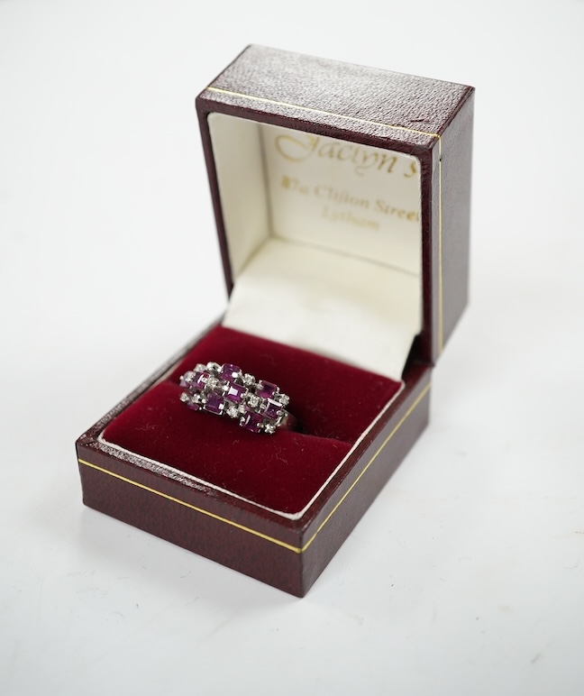 An 18k white metal, ruby and diamond cluster set cocktail ring, size K/L, gross weight 5.7 grams. Condition - fair to good